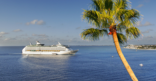 Cruise Vacations | Cruise ship with palm tree in foreground